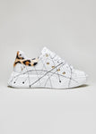 Sneakers with high sole with splashes of paint and leopard-print studs