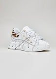 Sneakers with high sole with splashes of paint and leopard-print studs