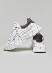 High sole sneakers with paint splatters and gold studs