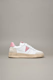 White sneaker with pink back and insert